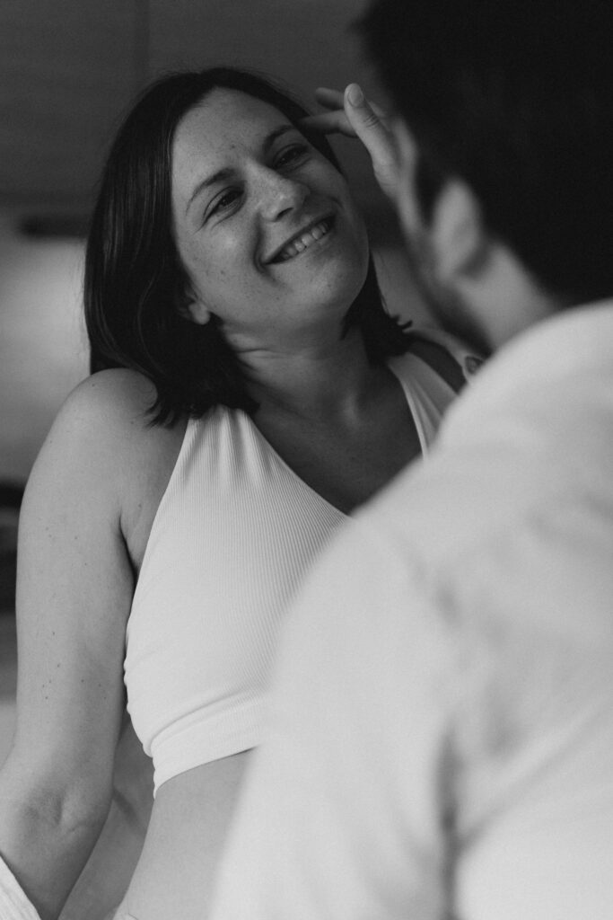 Natural candid portrait of a couple focused on each other, not the camera