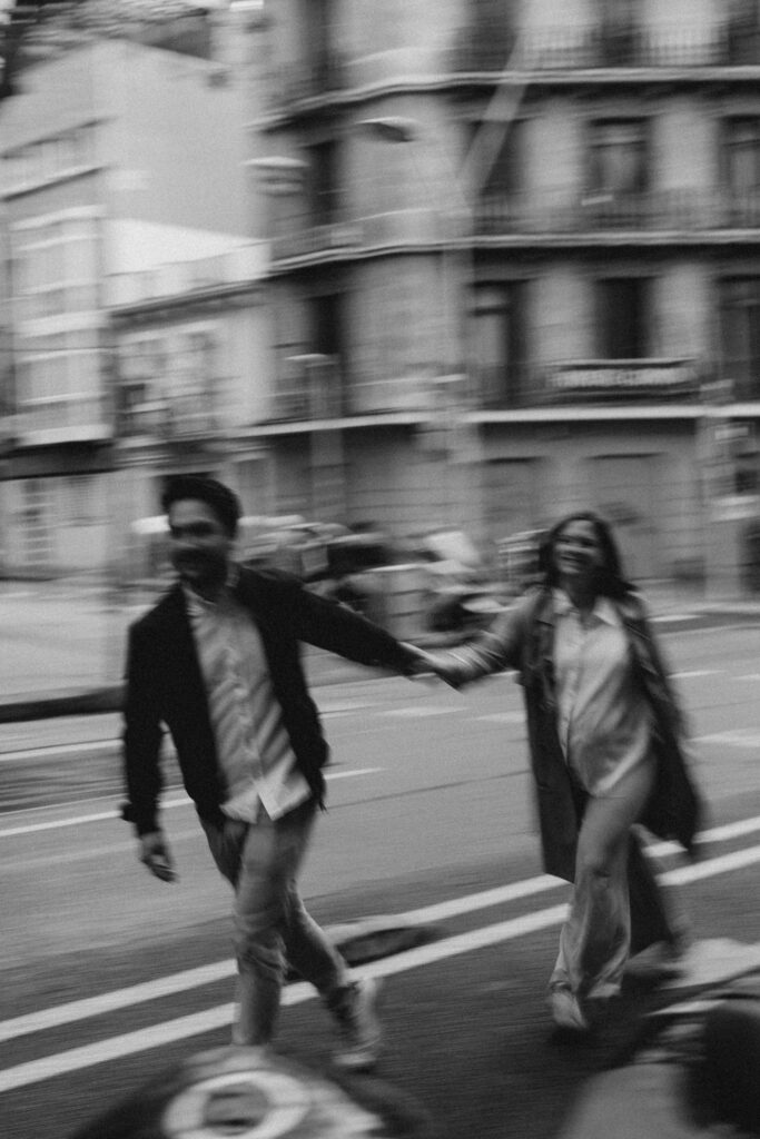 Couple walking hand in hand during a relaxed engagement photoshoot route